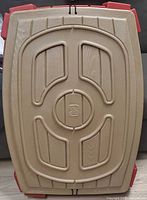 Brown molded plastic lid with Step2 logo