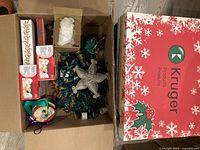 Overview of first box contents: sealed light sets, loose lights, star topper, ribbon spools