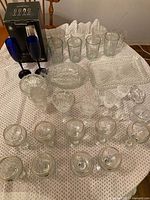 overview of all drinkware and crystal pieces on table
