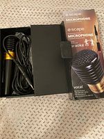 Microphone in open box with retail packaging visible