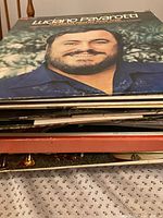 Stack of vinyl LPs with Luciano Pavarotti cover on top