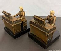 Front angle of both bronze-tone Beethoven bookends on black bases