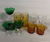 Group view of all ten glasses and mugs