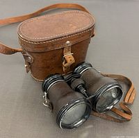 Binoculars and leather case overview