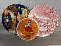 Group shot of three plates showing designs and relative sizes