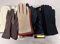 Stack showing multiple glove pairs and materials