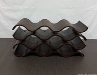 Front view showing four wave tiers and wood grain