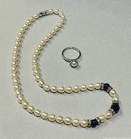 Full view of pearl necklace and 925 silver pearl ring
