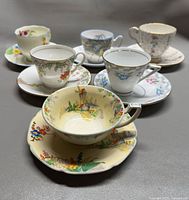 All six teacup and saucer sets, front view