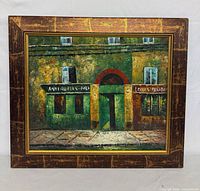Front view of framed painting showing storefront scene and frame detail