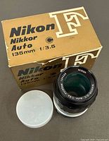 Lens with box and caps