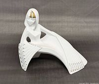 Front angled view showing full shape and decorative skirt pattern