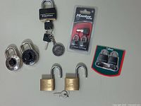 Group image showing all locks including sealed packs, Garrison padlocks and Master lock