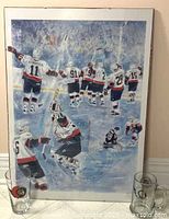 Overall view showing framed Ottawa Senators print with two glasses in foreground