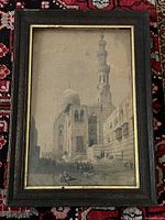 Front view of framed lithograph showing full image, frame and glass