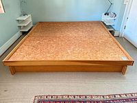Full view of wood king platform bed frame front angle