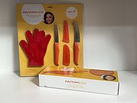 Blister pack set with glove and knives beside boxed knife set