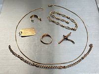 Group view of all gold pieces on metal surface