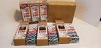 Eight Bicycle American Legend 100-chip boxes, some opened to show chip trays
