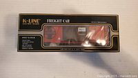 Front view of boxed K-Line O/027 Freight Car showing window with Santa Fe reefer inside