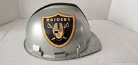 Front view showing Raiders logo and overall helmet condition