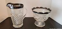Pitcher and footed bowl front view showing pattern and platinum rims