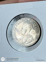 Obverse of 1933 Canadian 25-cent coin in 2x2 holder