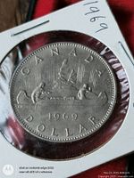 Reverse of 1969 Canada dollar showing Voyageur design in 2x2 flip