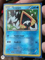 Front of Snorunt reverse holo Pokémon card showing card number, attacks, and foil surface