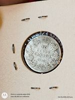 Reverse of 1910 Canada 10 cent coin showing denomination, date, wreath