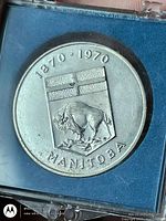 Obverse showing Manitoba shield, bison and dates