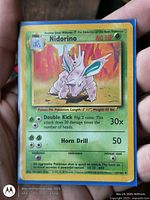 Front of Nidorino Base Set Pokémon card in sleeve