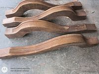 Four carved wooden legs side view