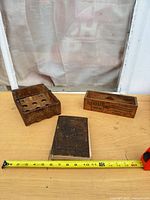 Overview of cookbook, egg crate, and Kraft box with measuring tape for scale