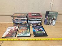 Two stacks of DVDs, three cases front facing, Roswell Season One box set