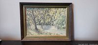 Full view of framed oil painting