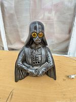 Front view of Darth Vader lamp showing yellow eyes and cord