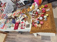 Overview of ornaments, dishes, runner and boxed items on table