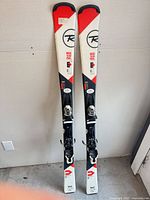 Full view of both Rossignol skis with bindings