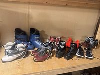 Shelf view showing all six pairs of youth footwear