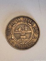 Reverse showing coat of arms, denomination and date