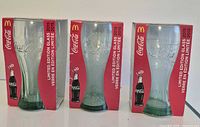 Front view of three boxed Coca-Cola glasses