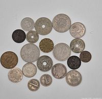 All 20 coins laid out, showing variety of sizes, metals and wear