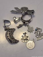 Assorted sterling silver jewellery spread out