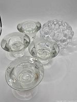 Group shot showing Orrefors bubbled holder and four flared IKEA holders