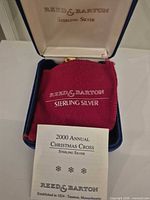 Reed & Barton sterling silver ornament in case with pouch and leaflet visible