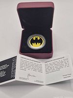 Coin in burgundy presentation case with COA