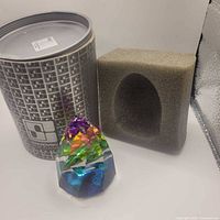 Paperweight, box, and foam insert together