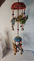 Full view of hanging two-tier elephant wind chime