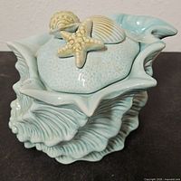 Top perspective of ceramic jar with lid on